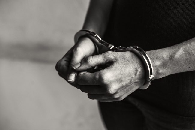 Criminal in handcuffs detention