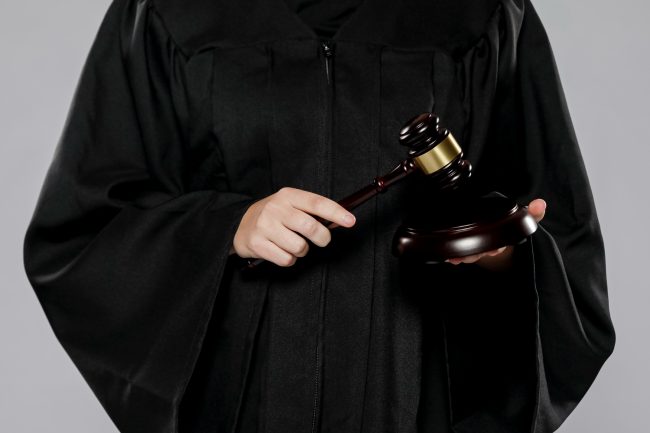 front-view-female-judge-with-gavel